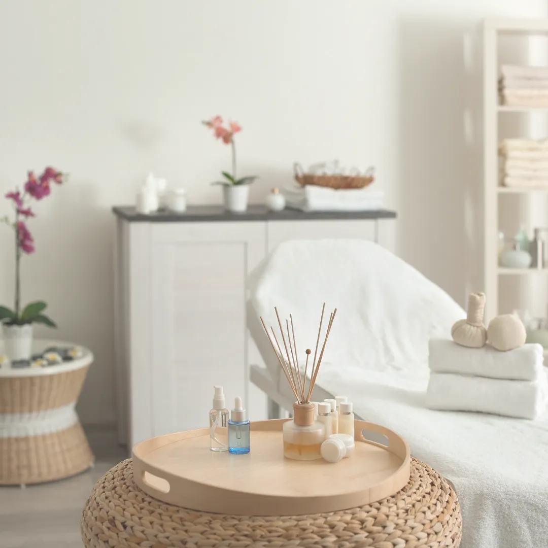 A pristine, well-equipped treatment room in a luxury wellness center, representing the high standard of client care and professional environment achievable through a scalable holistic business model.